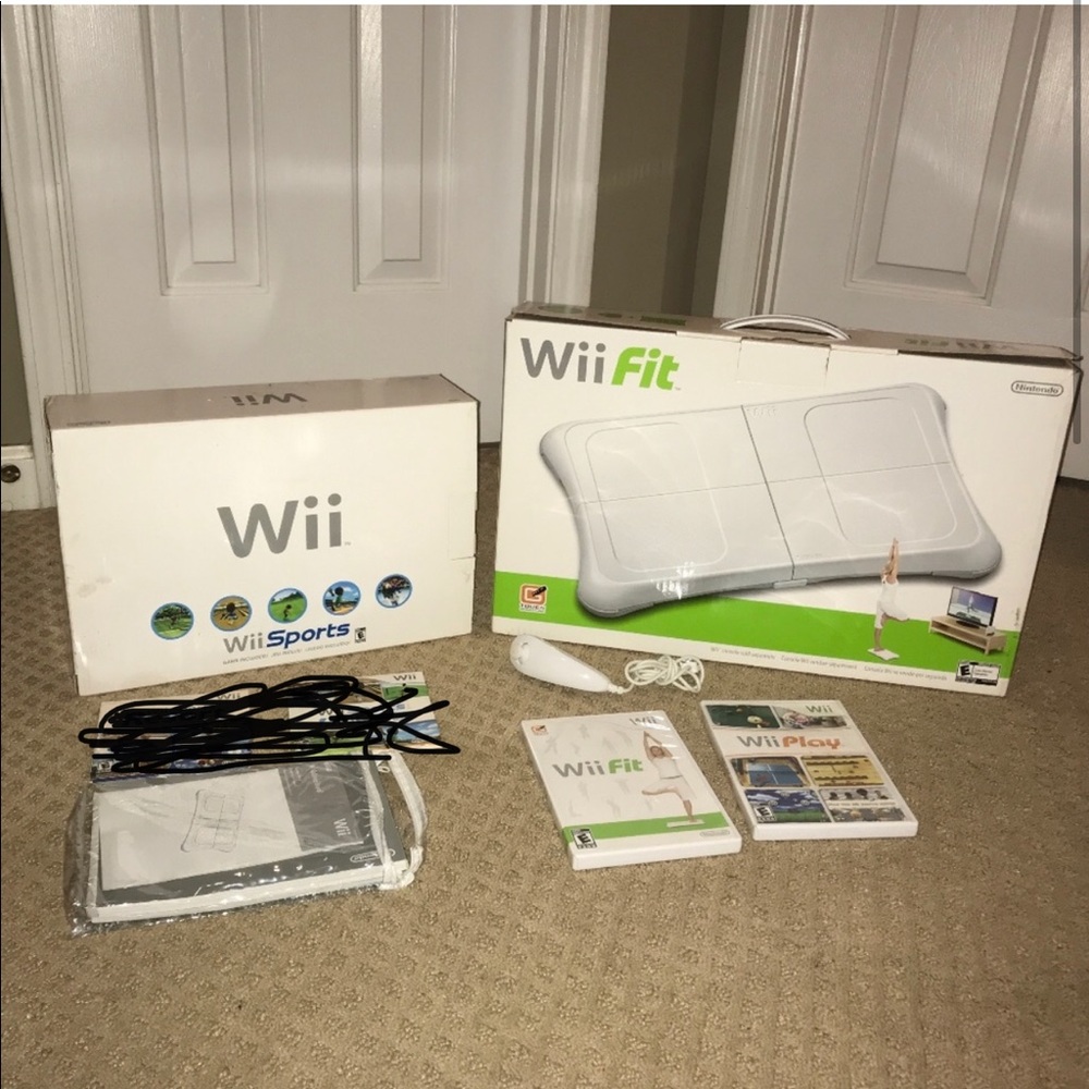 Wii console + wii fit + wii fit dvd + joystick + wii dvd